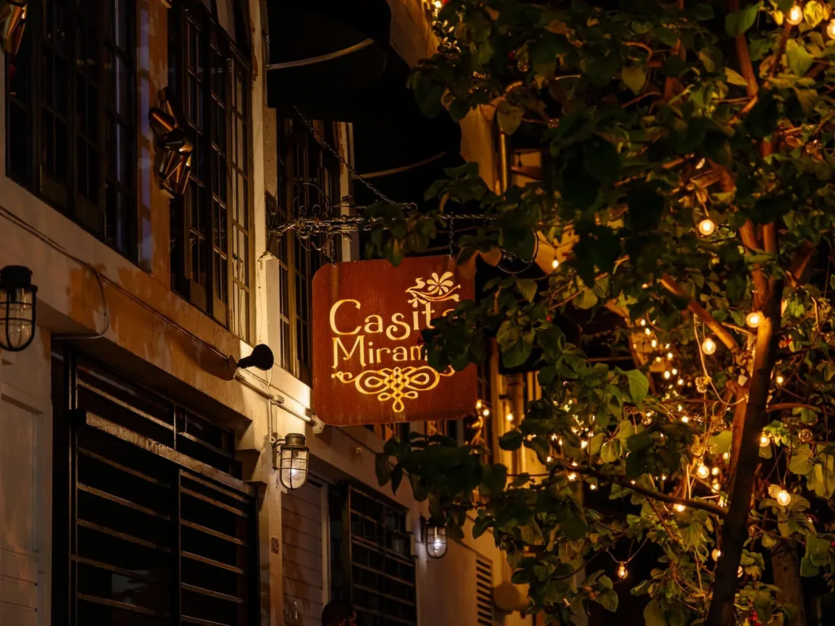 Casita Miramar’s illuminated sign and restaurant entrance