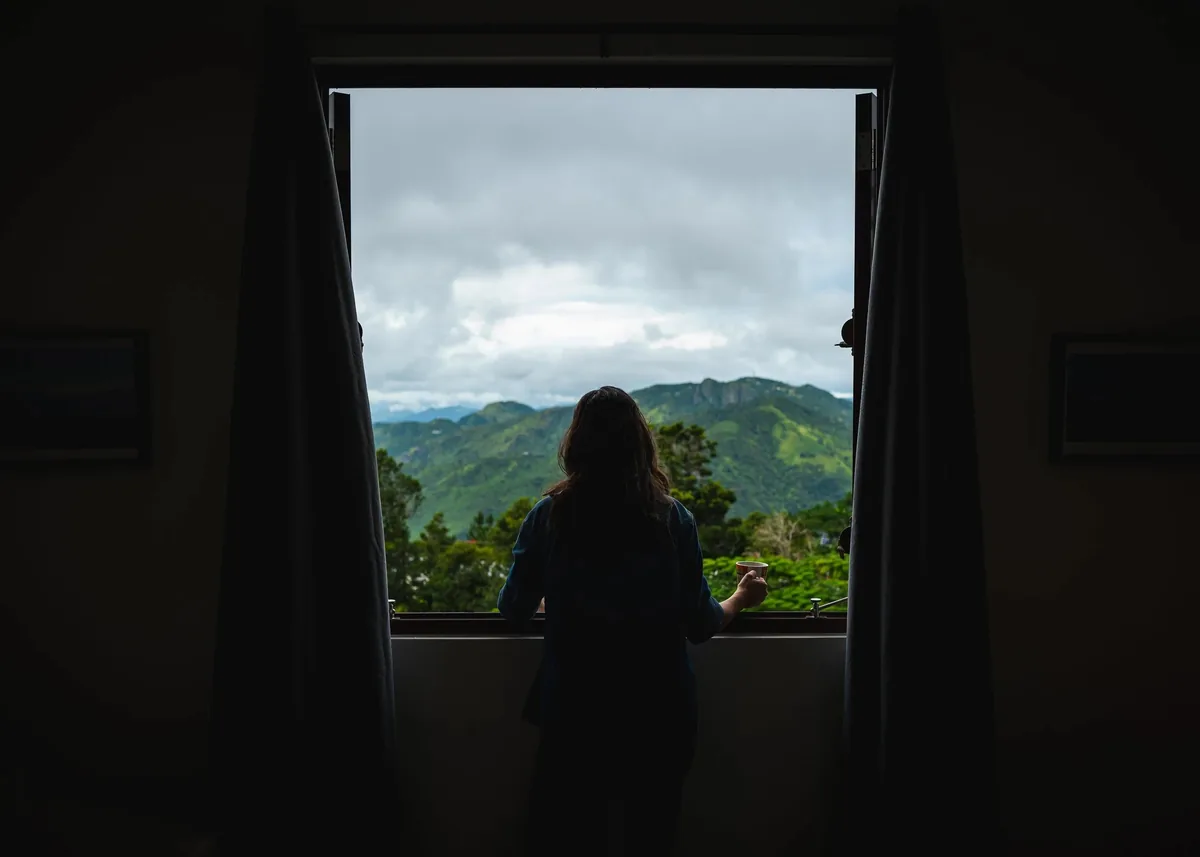 Mountain scenery viewed through a room at El Pretexto in Cayey.
