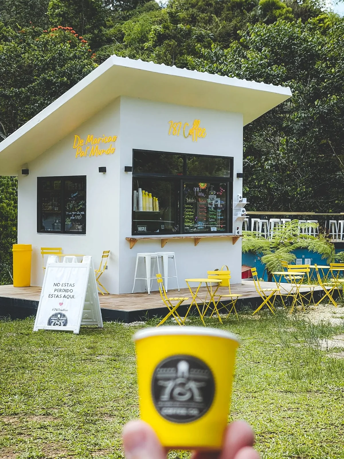 The 787 Coffee kiosk and outdoor seating at Hacienda Iluminada.