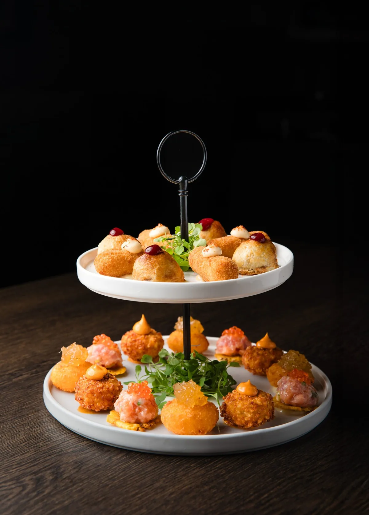 Two-tier platter of appetizers at Mario Pagán Restaurant